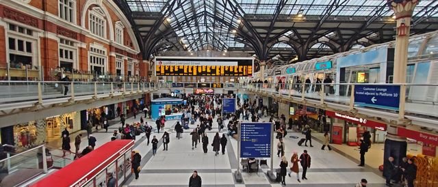 The busy main concourse of Liverpool Street station under its glass and iron roof